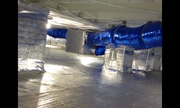 Inside new build with blue exposed duct work