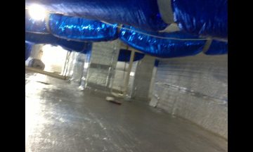 Inside new build with blue exposed duct work