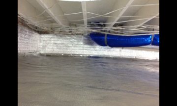 Inside new build with blue exposed duct work