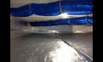 Inside new build with blue exposed duct work