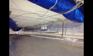 Inside new build with blue exposed duct work